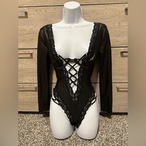 Black long sleeve lace-up bodysuit. Small
